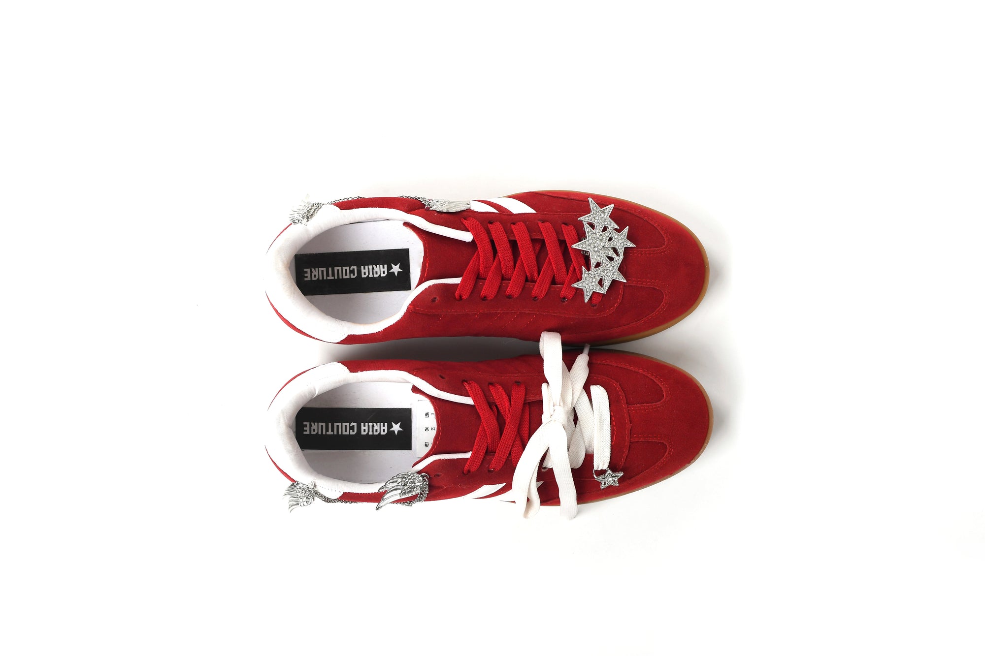 Red sneakers with white laces on a white background