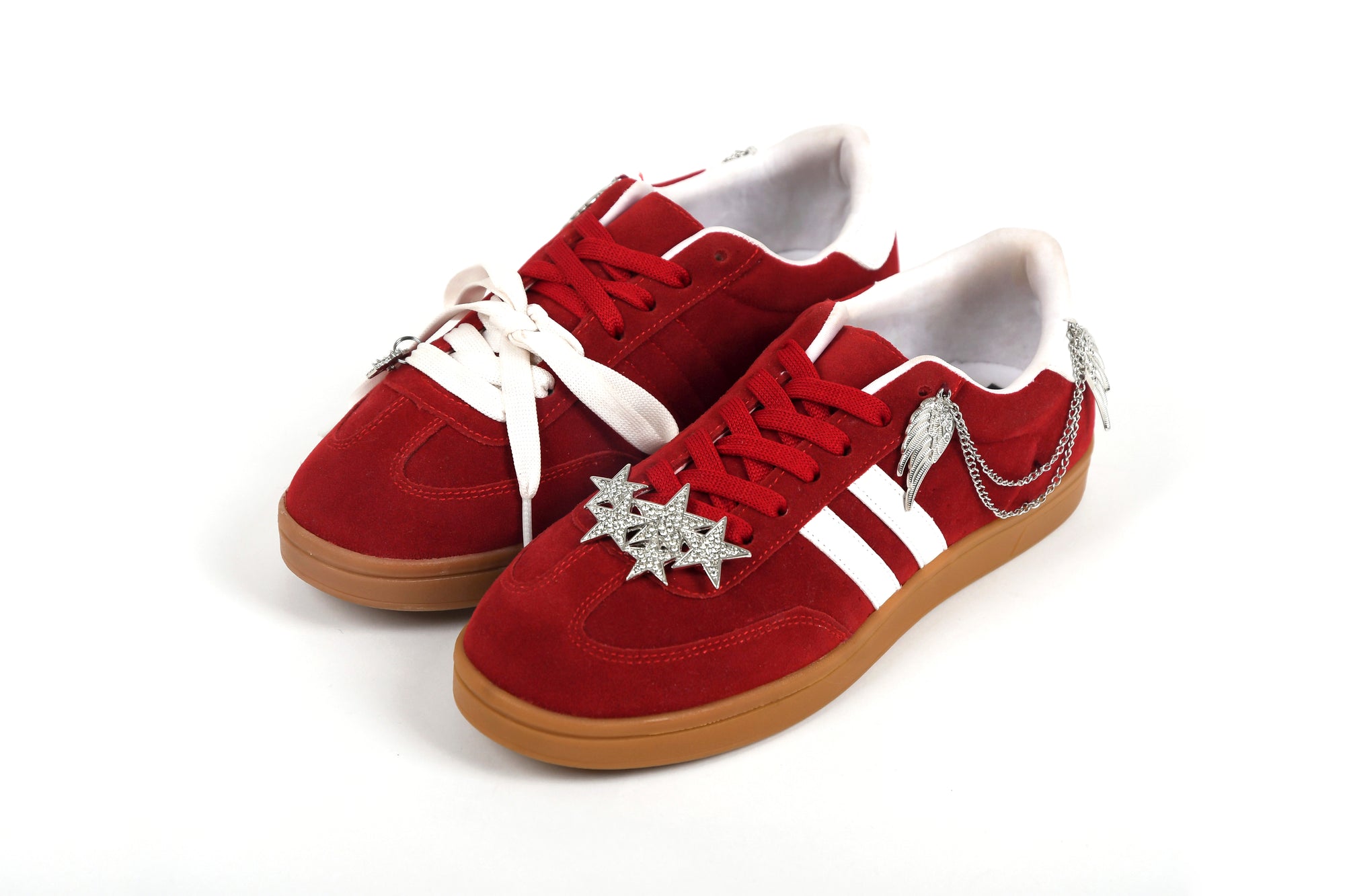 Red sneakers with white laces and soles on a white background